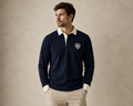 Male model wearing the navy Gammon Stamford Sporting Shirt with white collar and button cuffs against a textured neutral studio backdrop