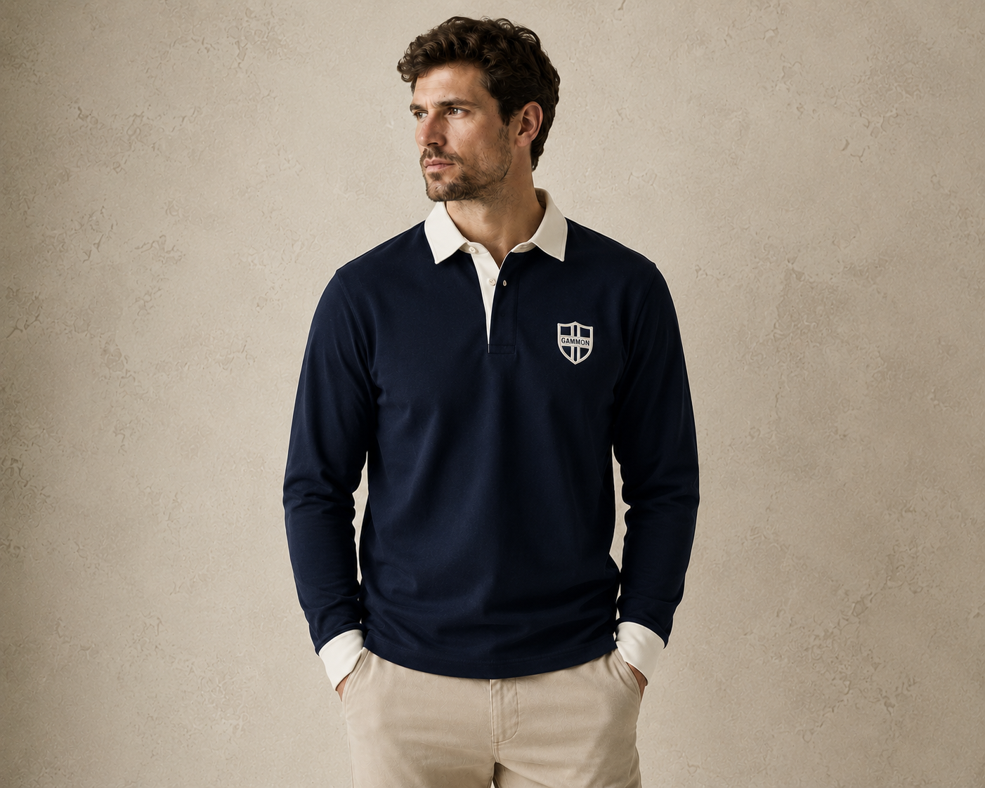 Male model wearing the navy Gammon Stamford Sporting Shirt with white collar and button cuffs against a textured neutral studio backdrop